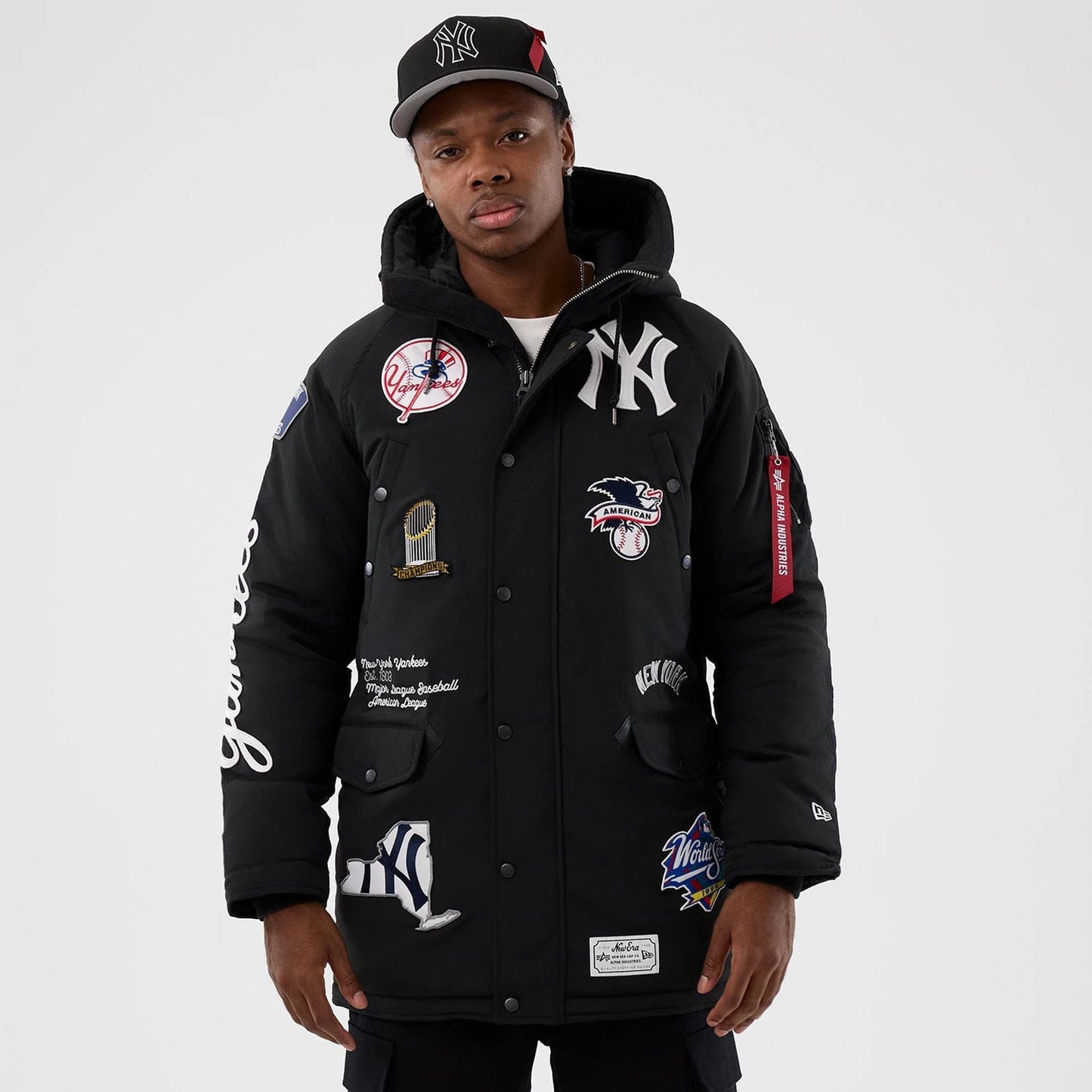 The Male model is wearing New York Yankees MLB X Alpha Black Parka Jacket 1