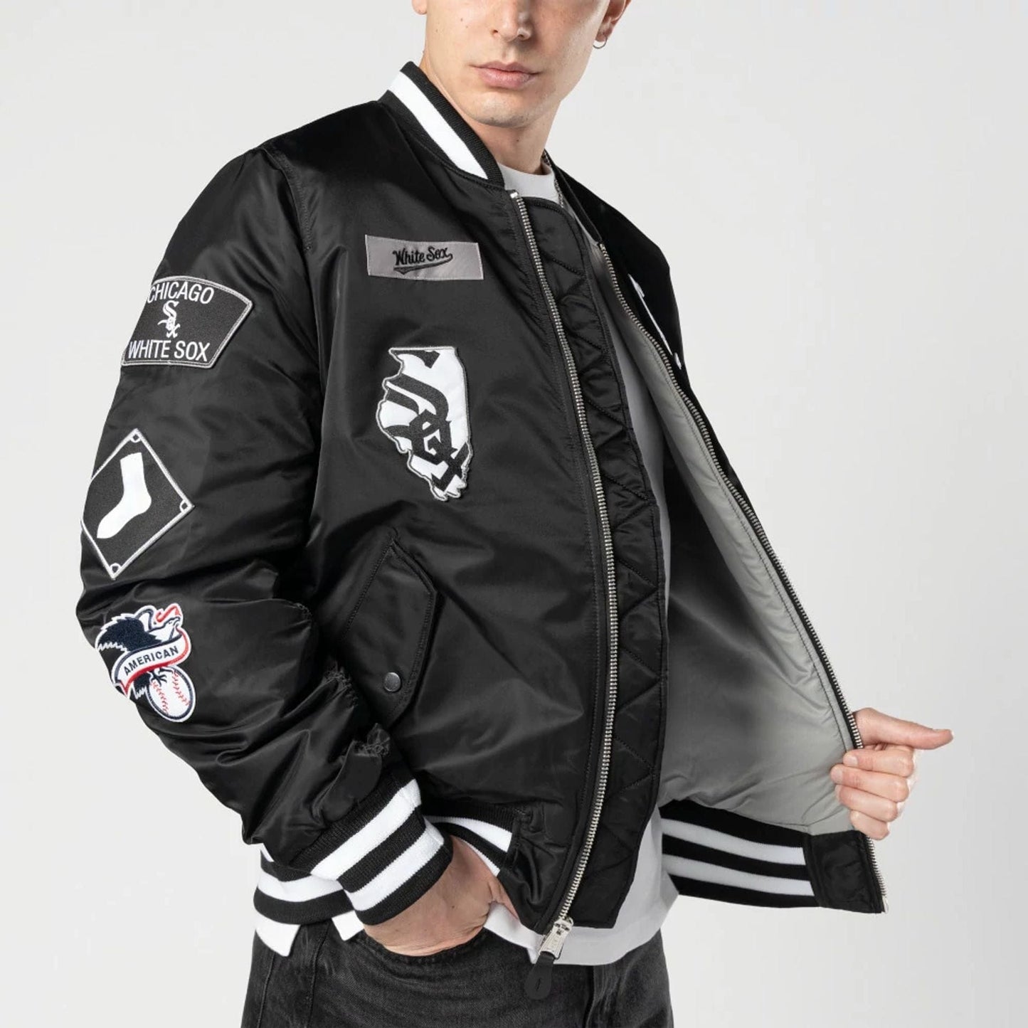 The Male model is wearing Chicago White Sox MLB X Alpha Black Bomber Jacket 3