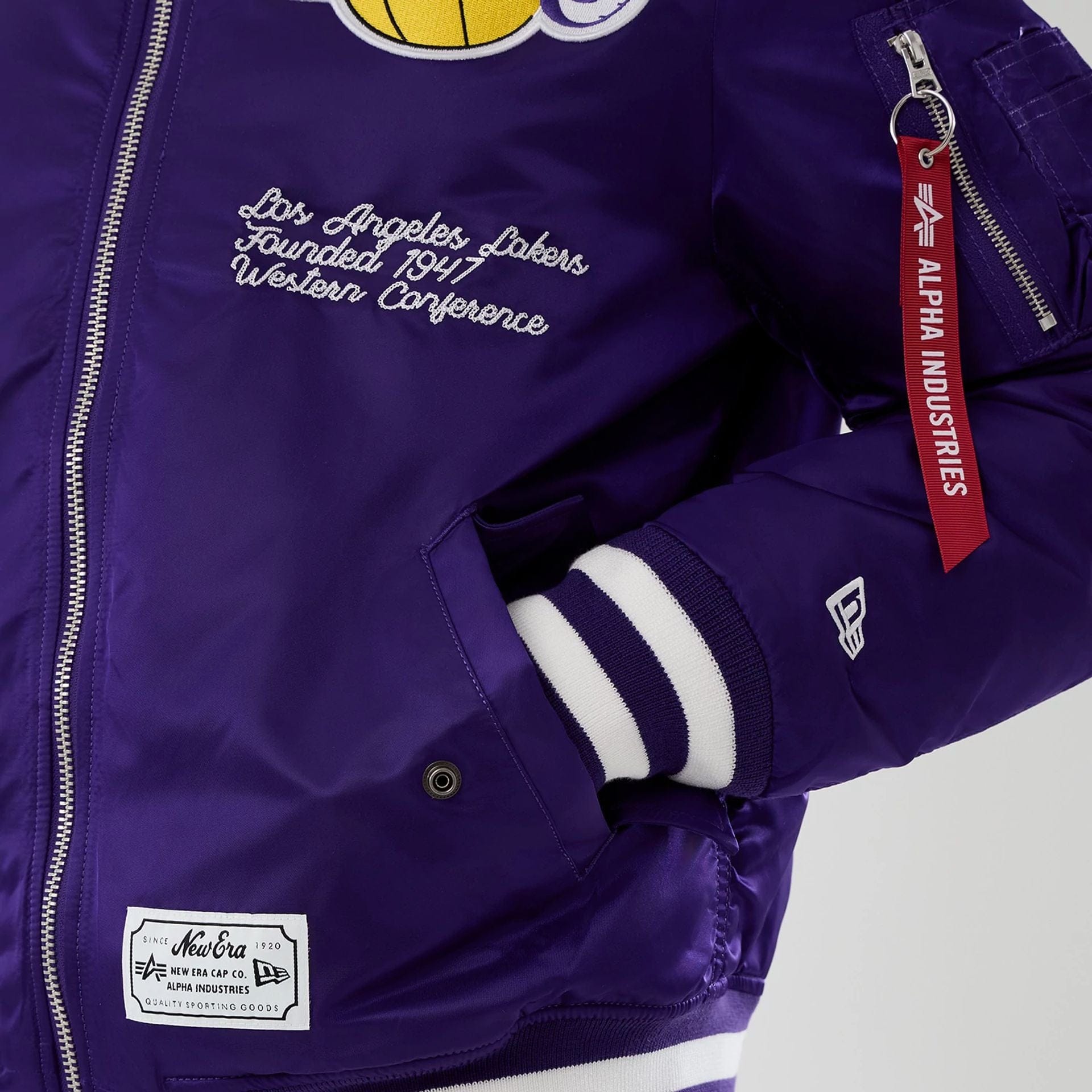 The Male model is wearing LA Lakers NBA x Alpha Purple Jacket 5