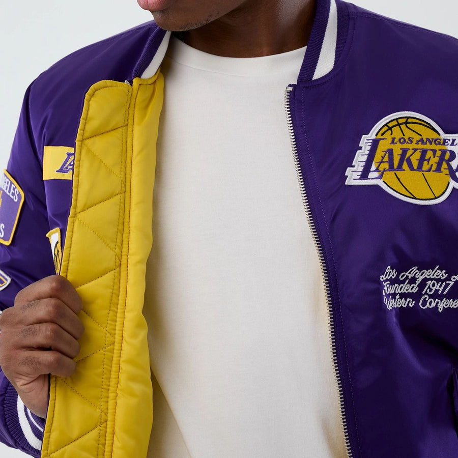 The Male model is wearing LA Lakers NBA x Alpha Purple Jacket 3