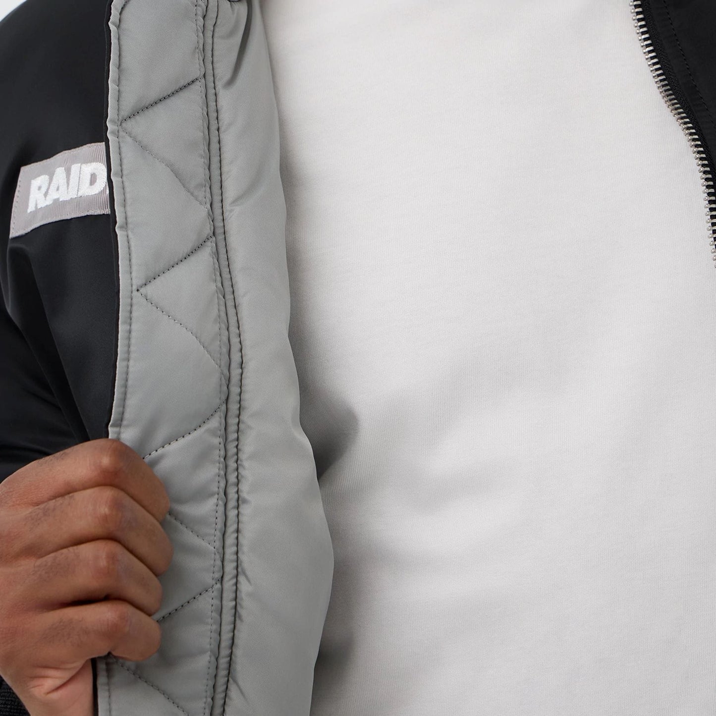 The Male model is wearing Las Vegas Raiders NFL x Alpha Black Jacket 3