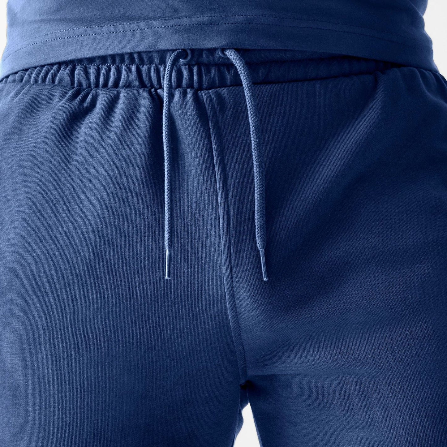 The Male model is wearing LA Dodgers MLB Midi League Essential Dark Blue Shorts 6