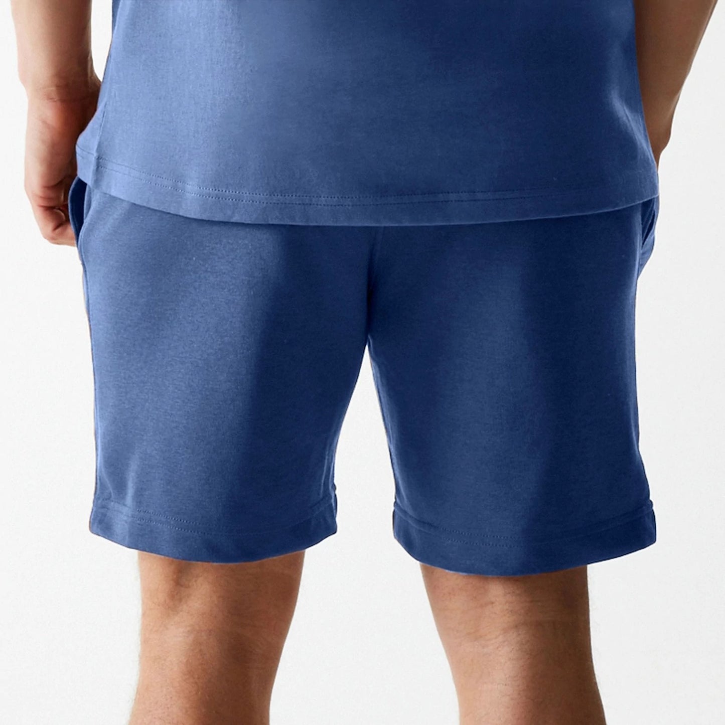The Male model is wearing LA Dodgers MLB Midi League Essential Dark Blue Shorts 7