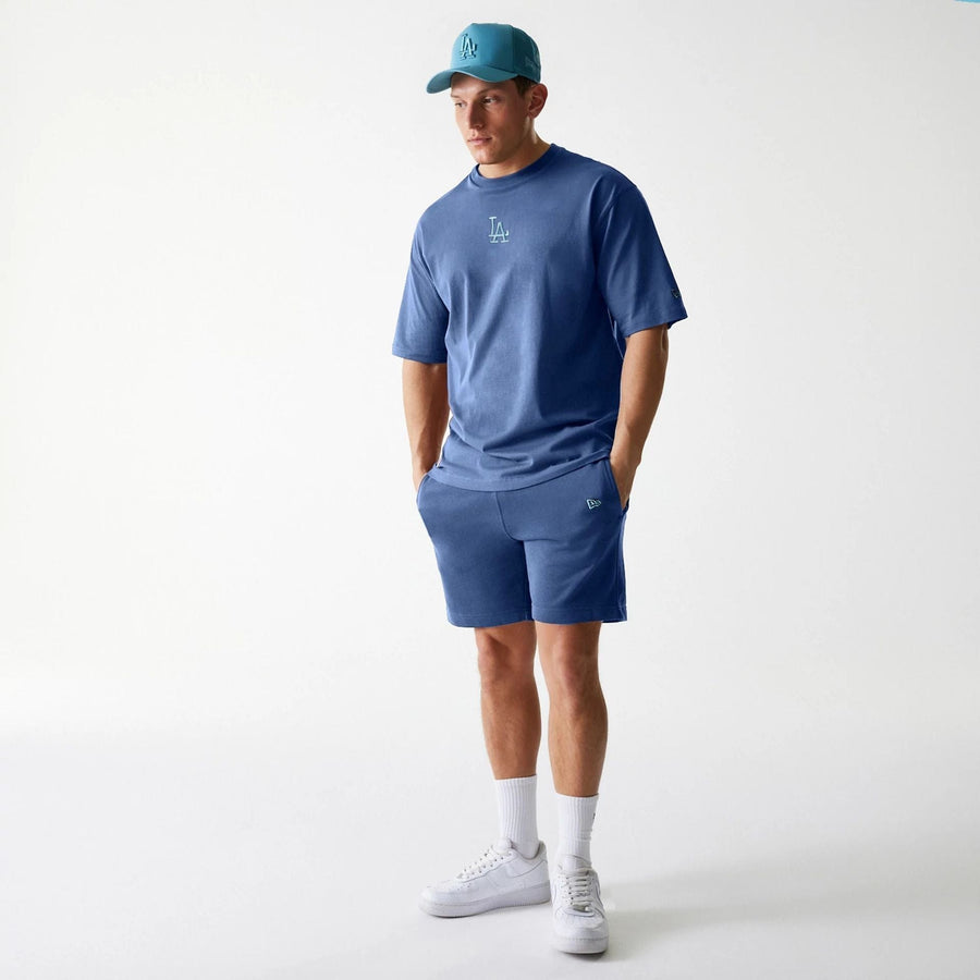 The Male model is wearing LA Dodgers MLB Midi League Essential Dark Blue Shorts 8