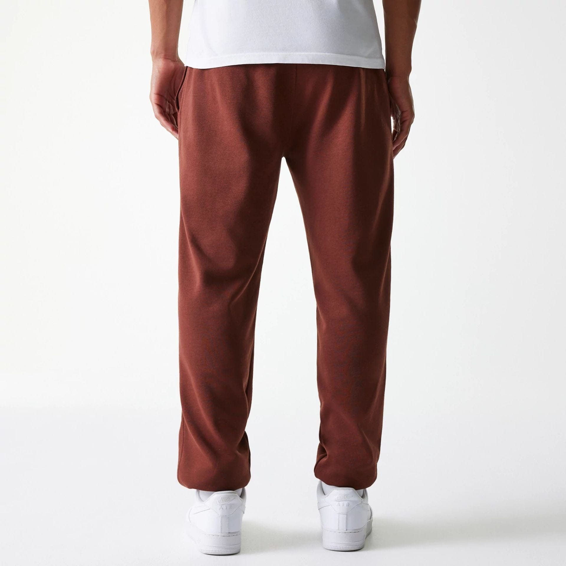The Male model is wearing New York Yankees MLB Midi League Essential Brown Joggers 2