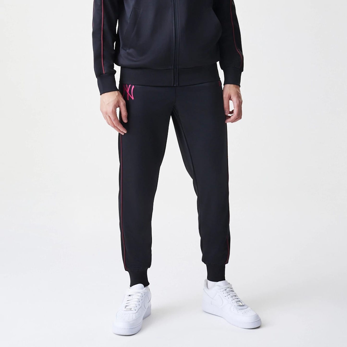 The Male model is wearing New York Yankees MLB Piping Black Track Pants 3