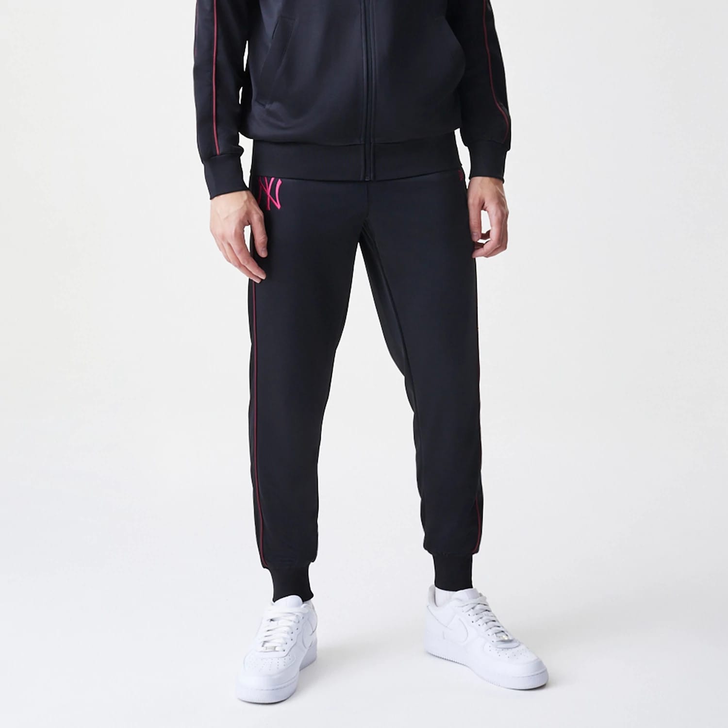 The Male model is wearing New York Yankees MLB Piping Black Track Pants 3