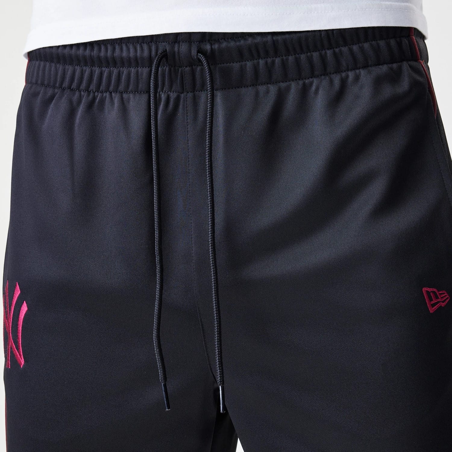 The Male model is wearing New York Yankees MLB Piping Black Track Pants 6