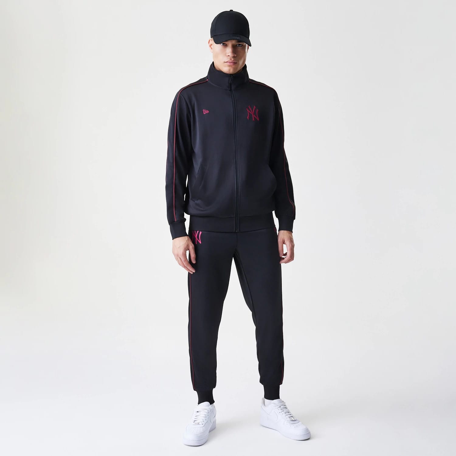 The Male model is wearing New York Yankees MLB Piping Black Track Pants 8