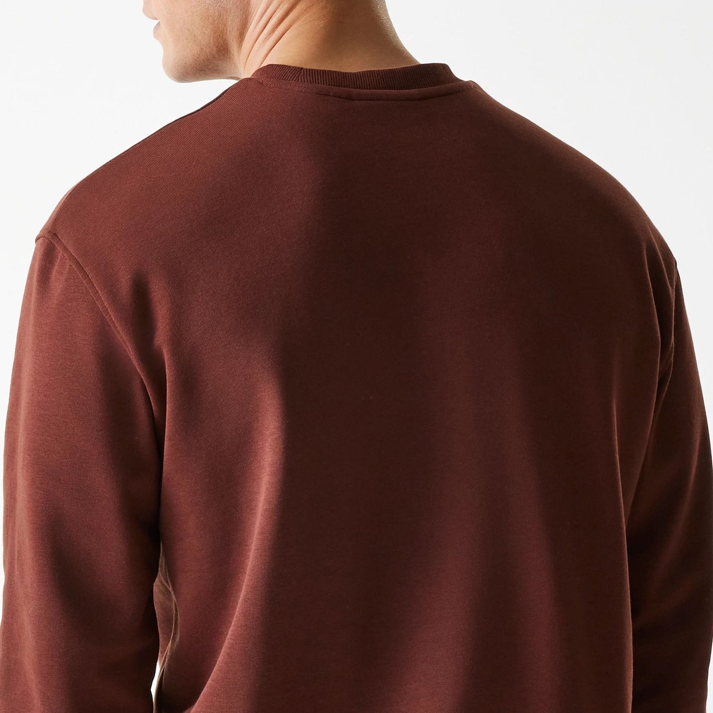 The Male model is wearing New York Yankees MLB Midi League Essential Brown Oversized Crew Neck Sweater 7