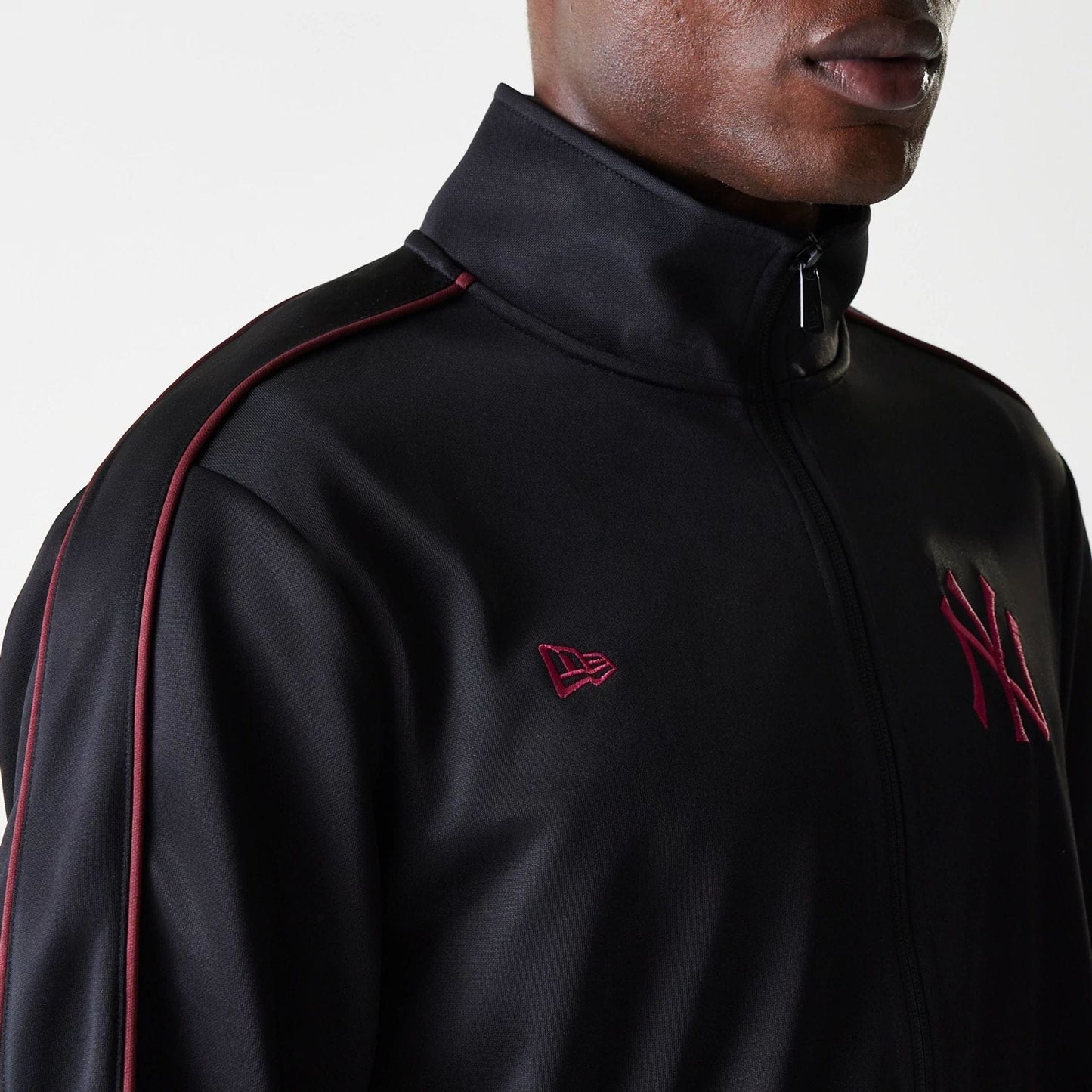 The Male model is wearing New York Yankees MLB Black Track Top 5