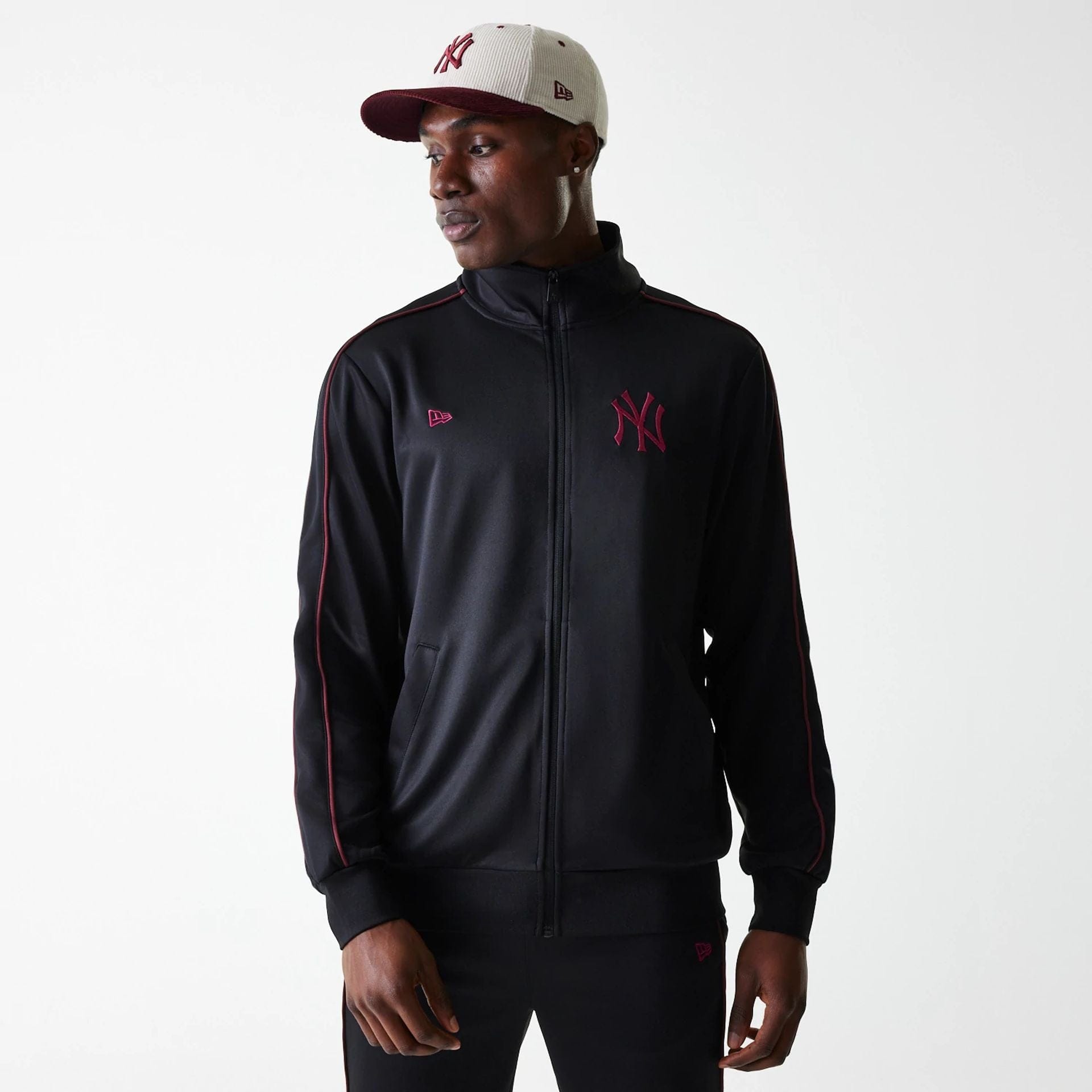The Male model is wearing New York Yankees MLB Black Track Top 1