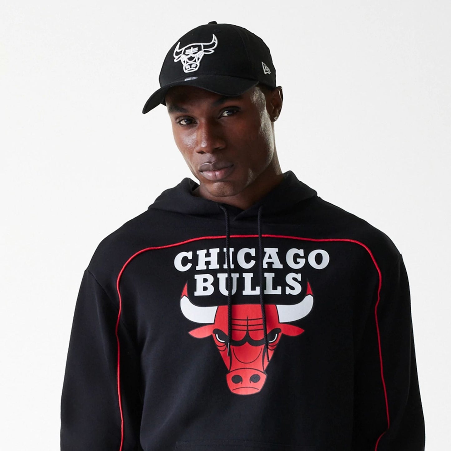 The Male model is wearing Chicago Bulls NBA Piping Black Oversized Pullover Hoodie 5
