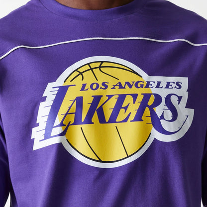 The Male model is wearing LA Lakers NBA Piping Purple Oversized T-Shirt 3
