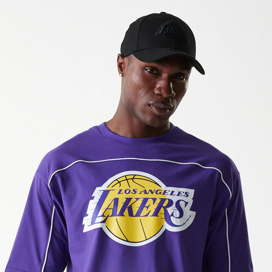 The Male model is wearing LA Lakers NBA Piping Purple Oversized T-Shirt 5