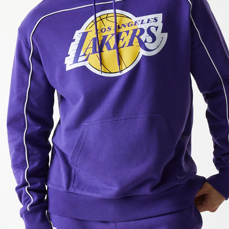 The Male model is wearing LA Lakers NBA Piping Purple Oversized Pullover Hoodie 3