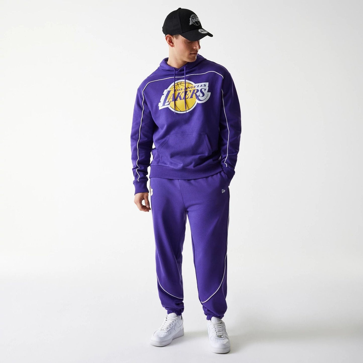 The Male model is wearing LA Lakers NBA Piping Purple Oversized Pullover Hoodie 7