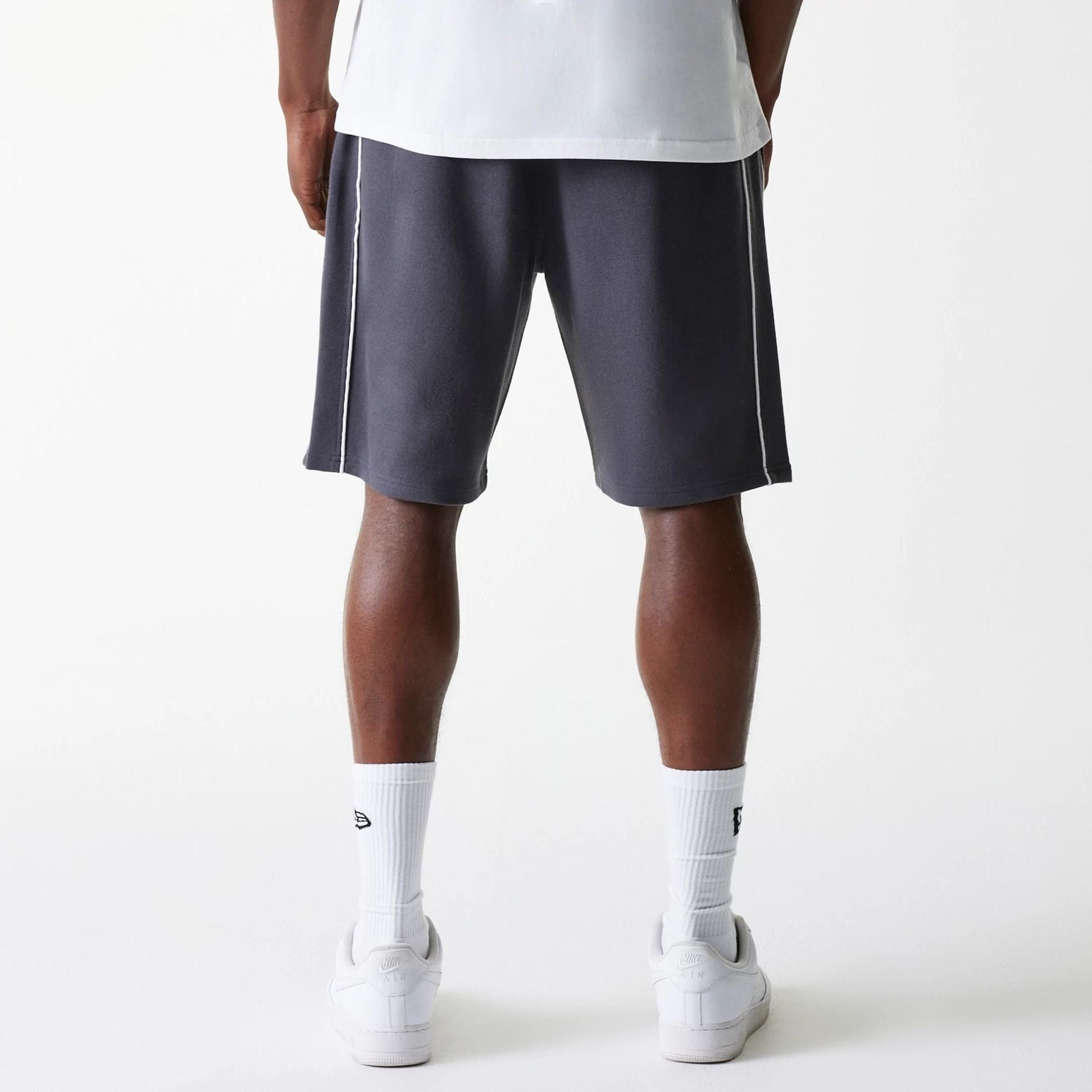 The Male model is wearing Boston Celtics NBA Piping Dark Grey Shorts 2