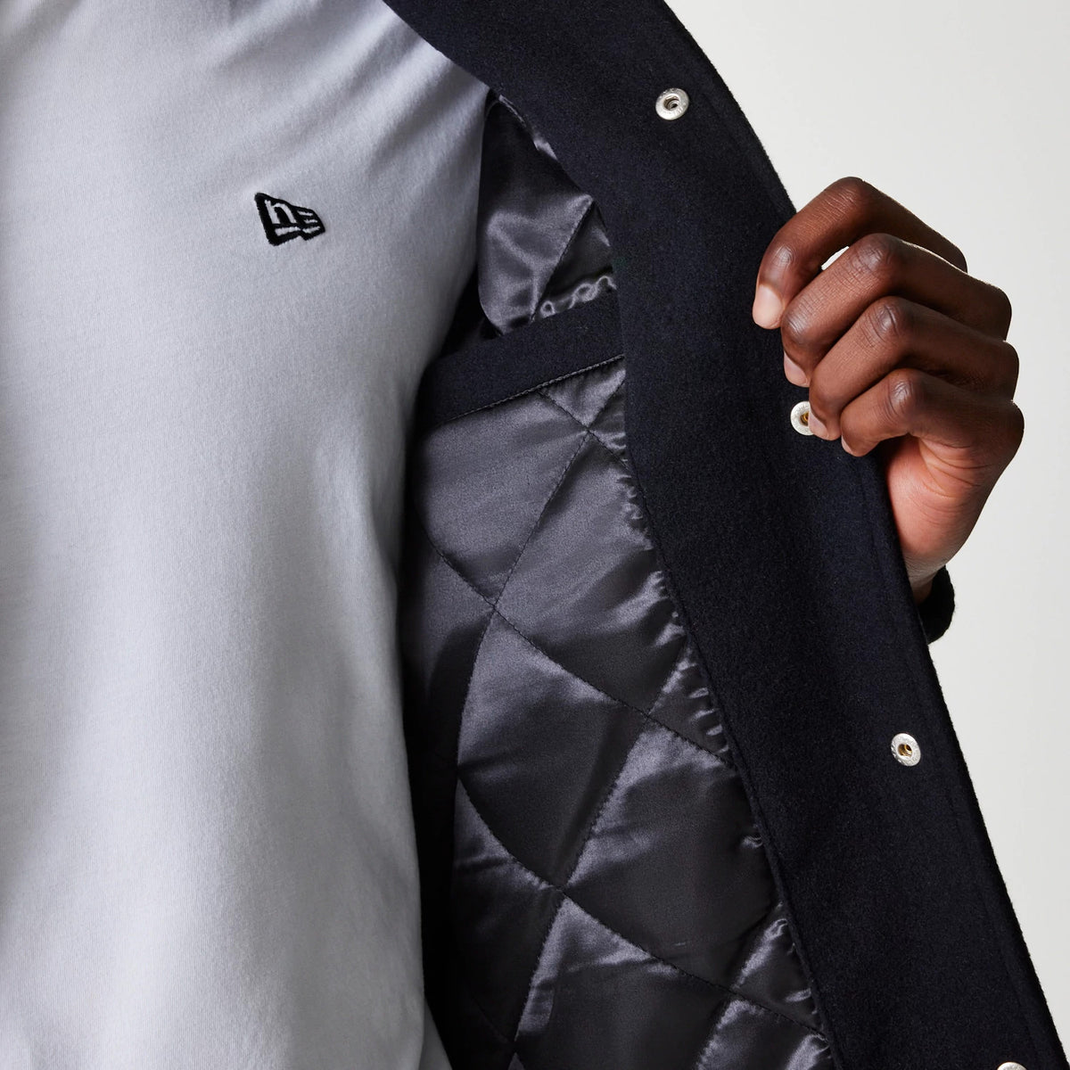 The Male model is wearing New York Yankees MLB Wordmark Black Varsity Jacket 6