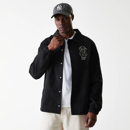The Male model is wearing New York Yankees MLB Twill Black Coaches Jacket 3