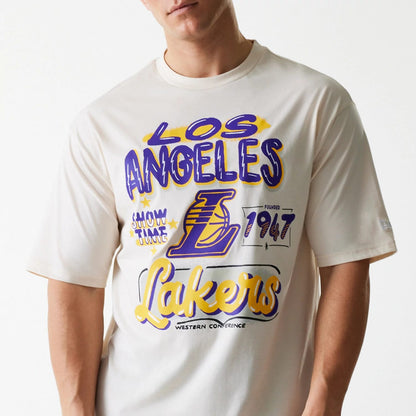 The Male model is wearing LA Lakers NBA Graphic Light Beige Oversized T-Shirt 3
