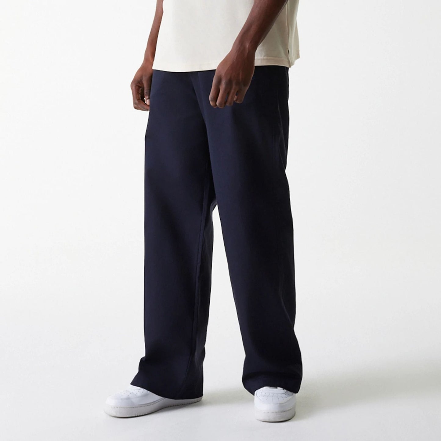 The Male model is wearing LA Dodgers MLB Navy Chino Trousers 3