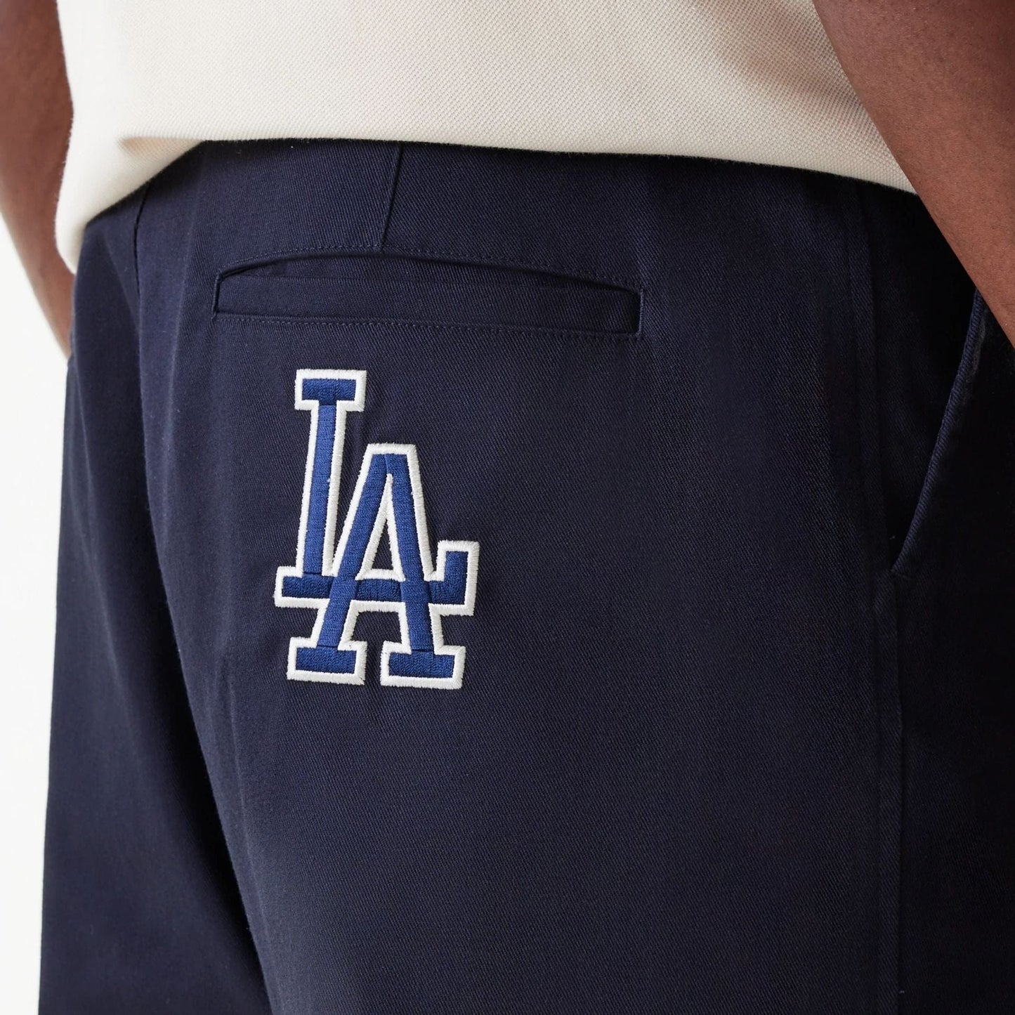 The Male model is wearing LA Dodgers MLB Navy Chino Trousers 4