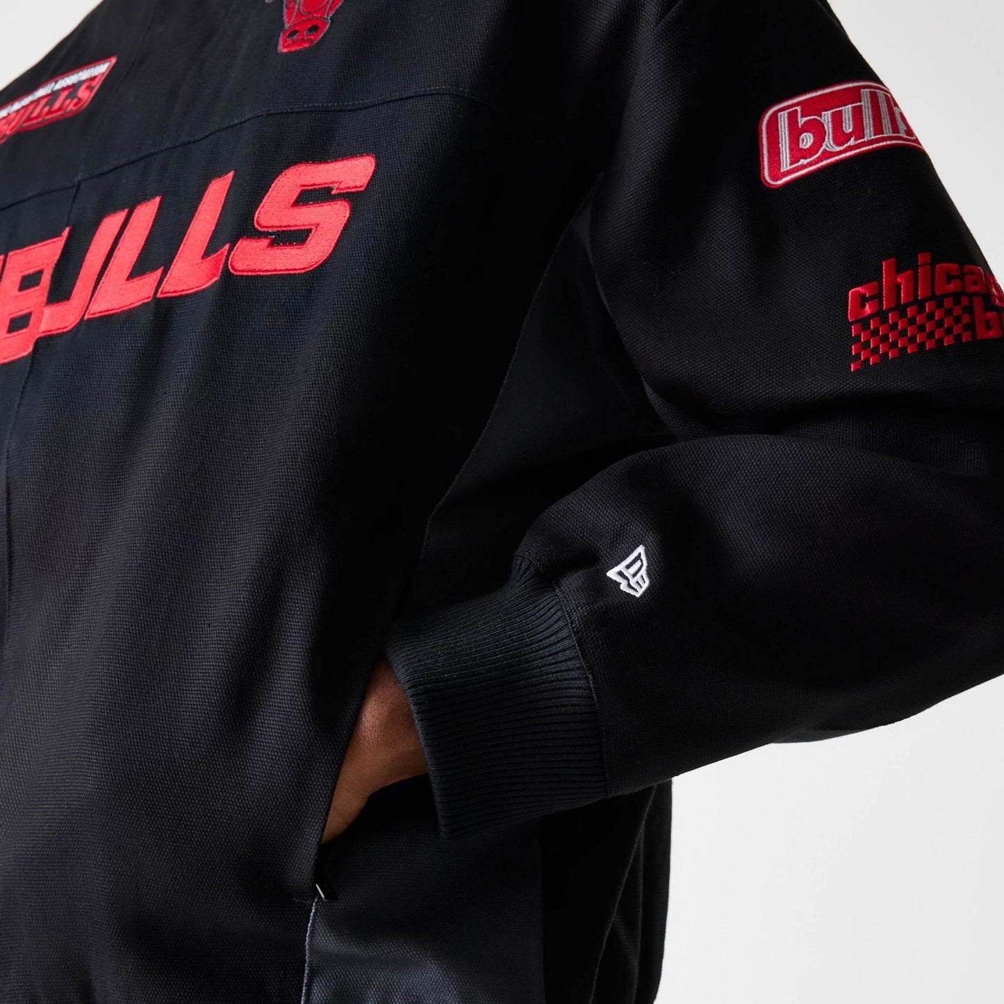 The Male model is wearing Chicago Bulls NBA Motorsport Black Motorsports Jacket 5
