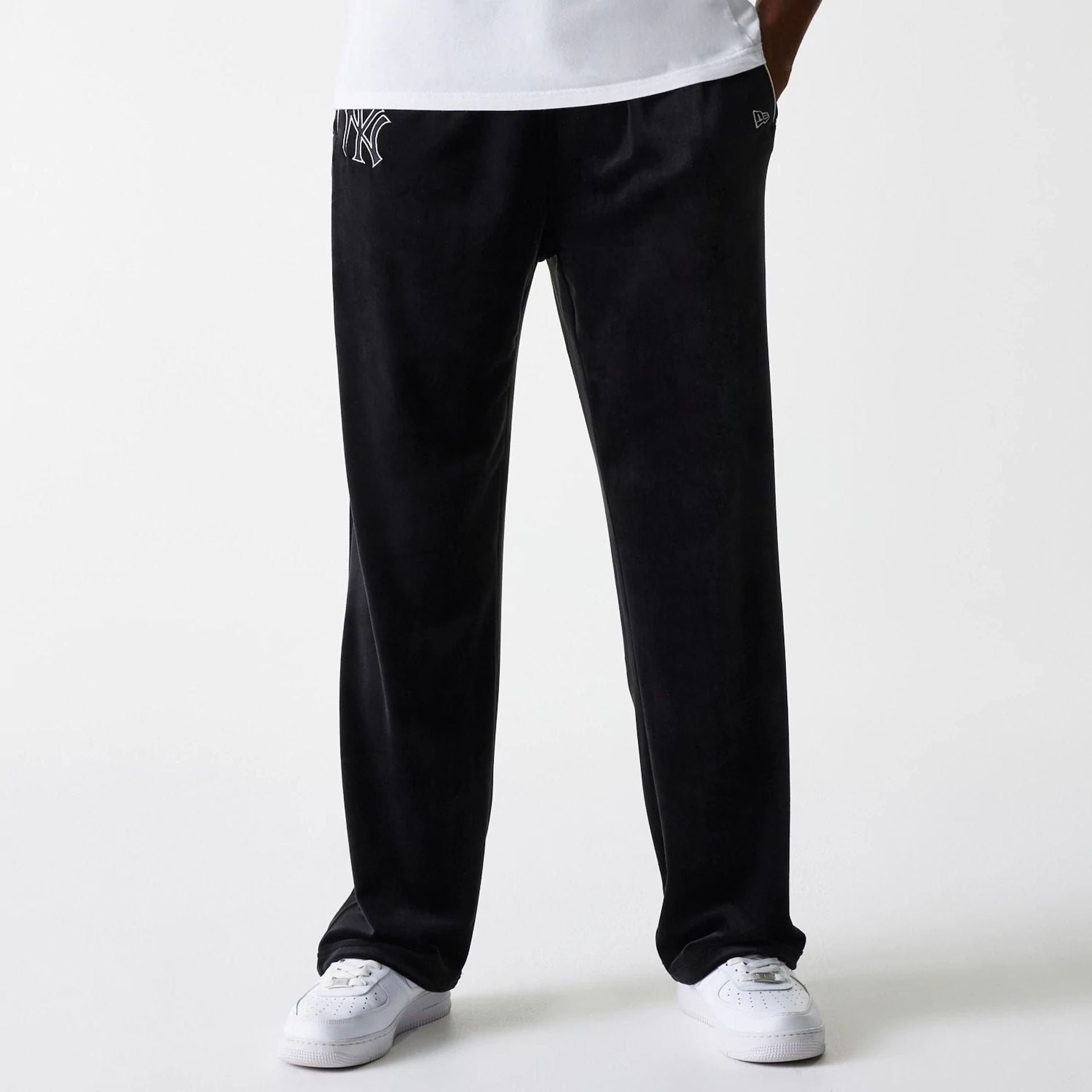 The Male model is wearing New York Yankees MLB Velour Black Track Pants 5