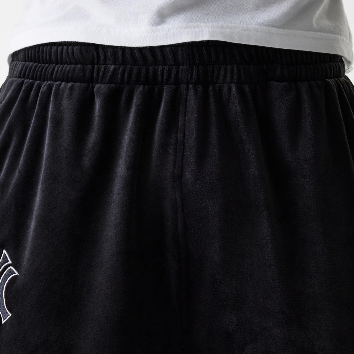 The Male model is wearing New York Yankees MLB Velour Black Track Pants 8