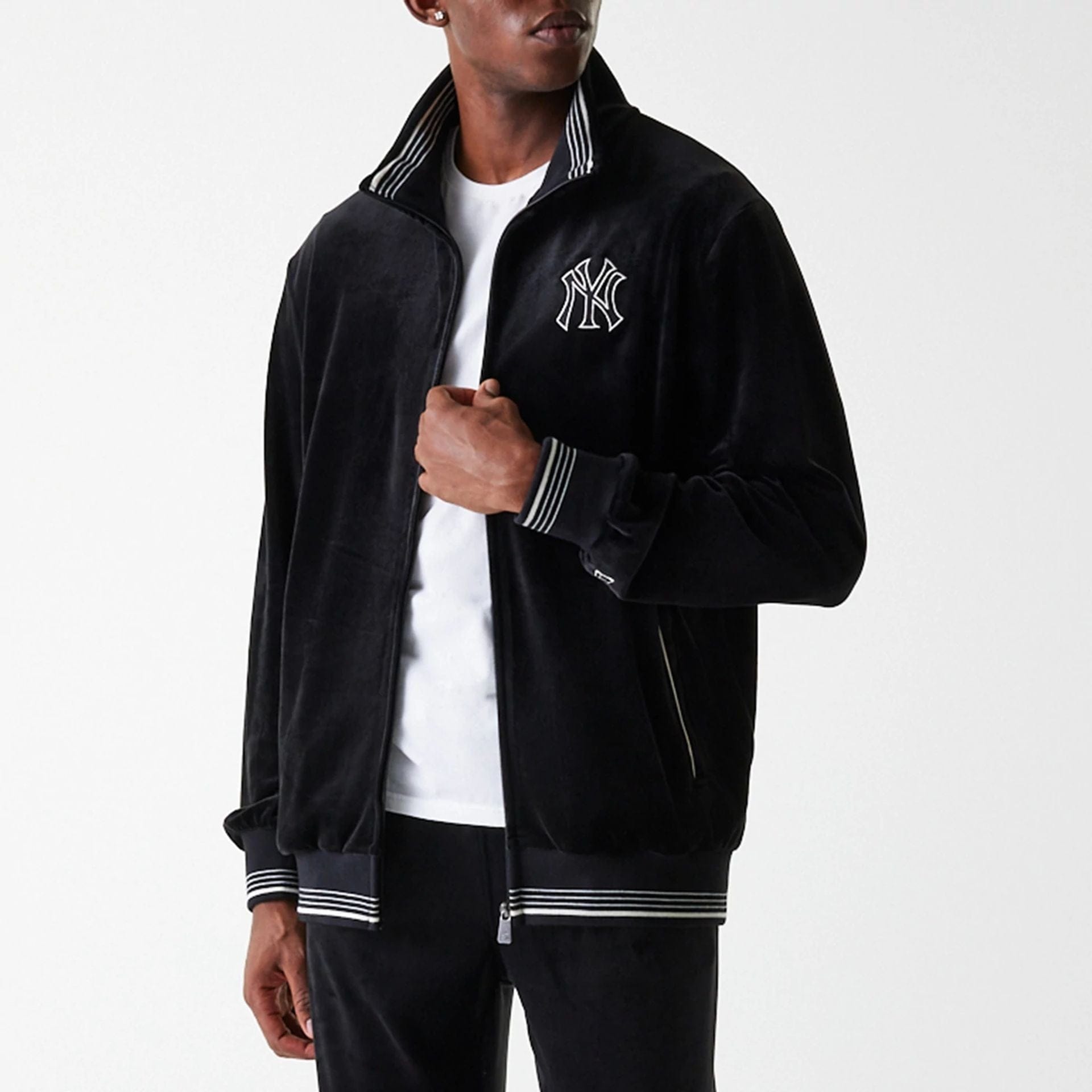The Male model is wearing New York Yankees MLB Velour Black Track Top 5