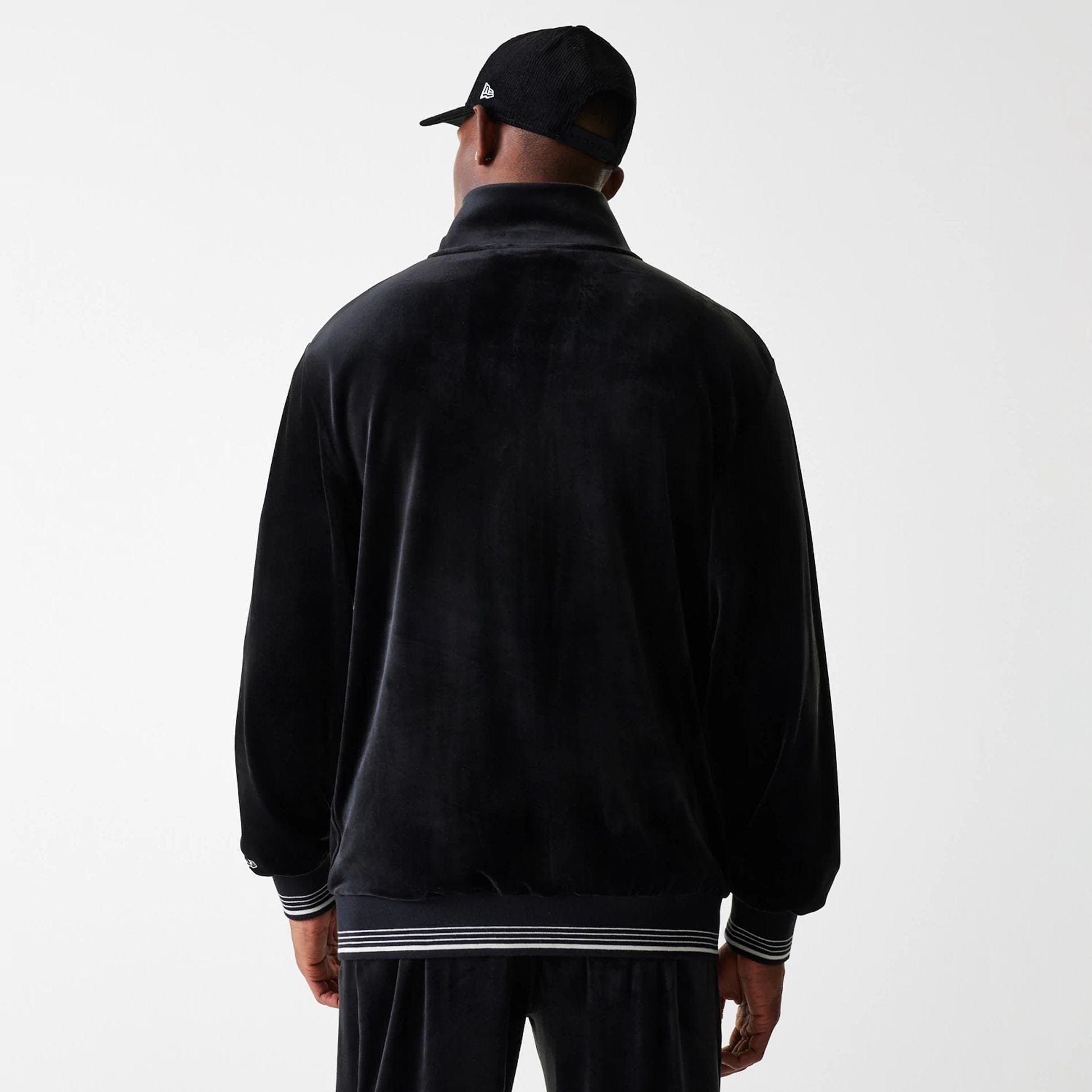 The Male model is wearing New York Yankees MLB Velour Black Track Top 2