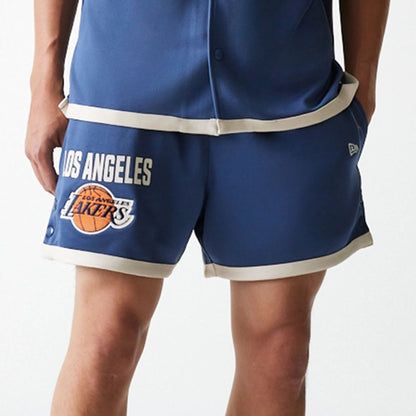 The Male model is wearing LA Lakers NBA Snap Button Dark Blue Shorts 3