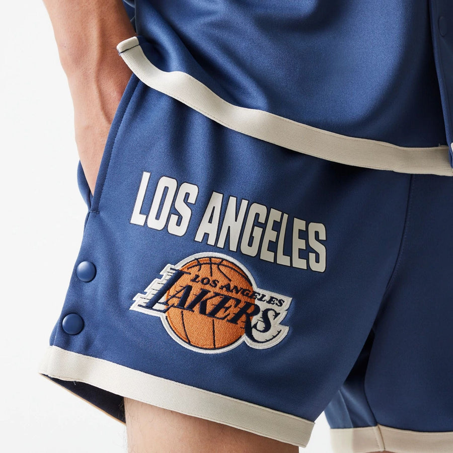 The Male model is wearing LA Lakers NBA Snap Button Dark Blue Shorts 4
