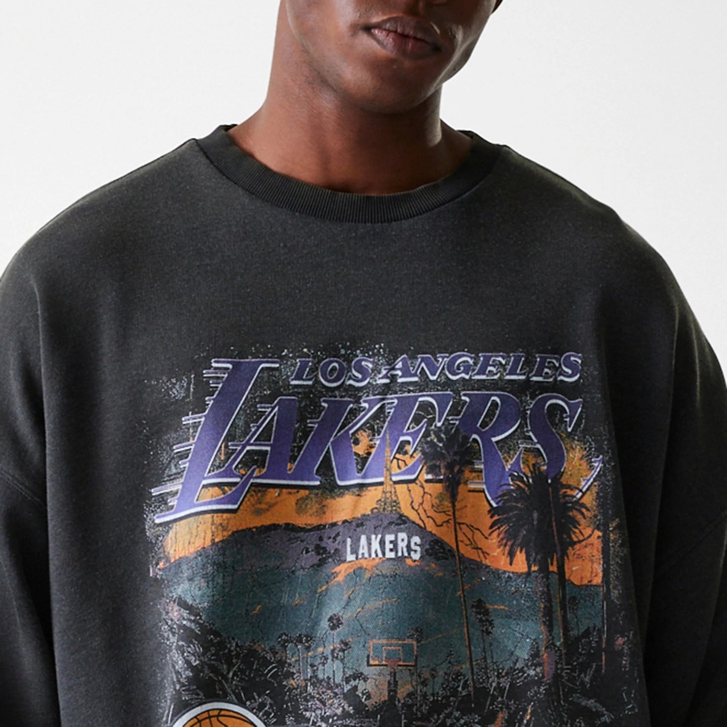 The Male model is wearing LA Lakers NBA Washed Graphic Grey Oversized Crew Neck Sweater 5