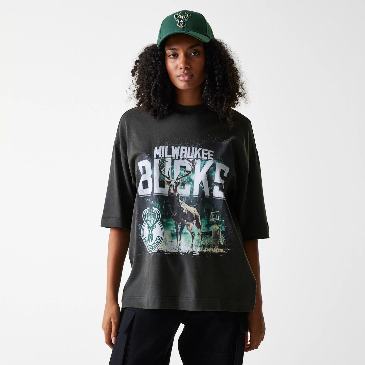 The Male model is wearing Milwaukee Bucks NBA Washed Graphic Grey T-Shirt 4