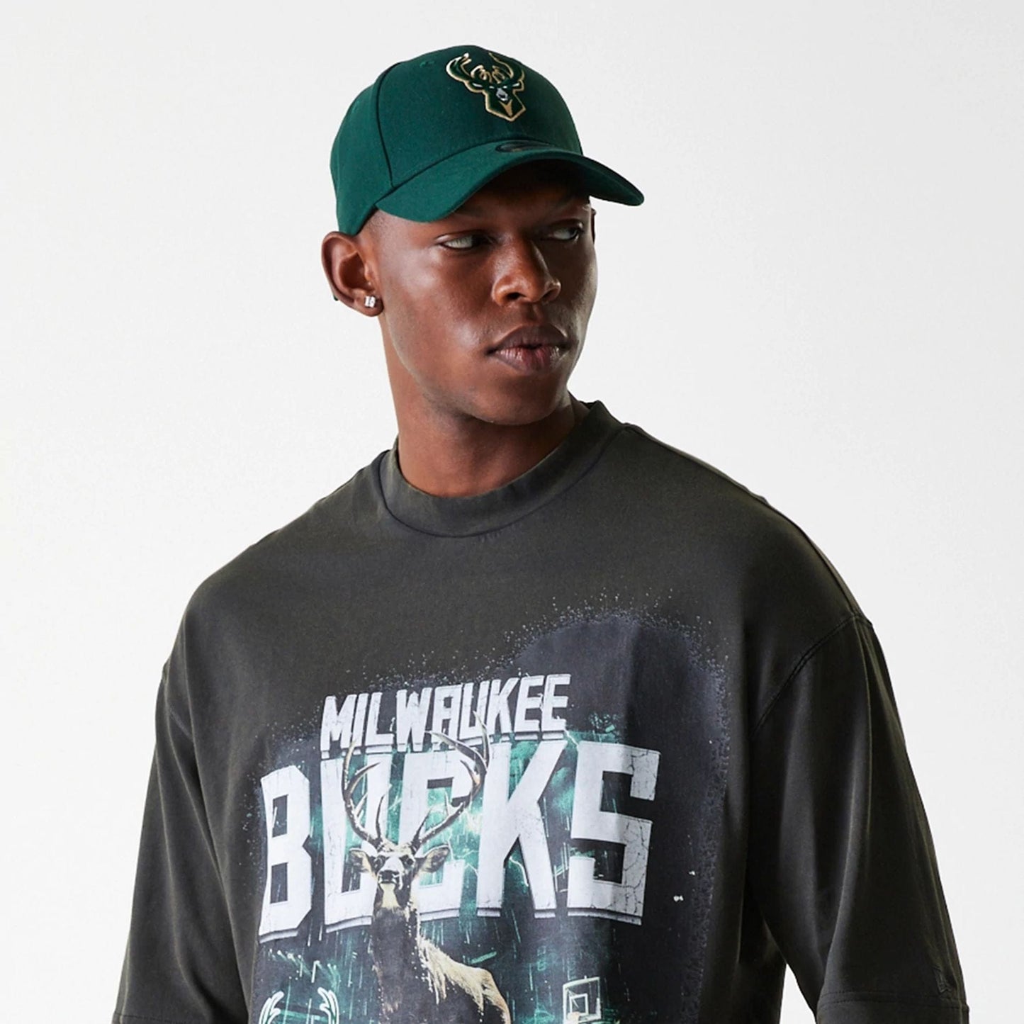 The Male model is wearing Milwaukee Bucks NBA Washed Graphic Grey T-Shirt 5