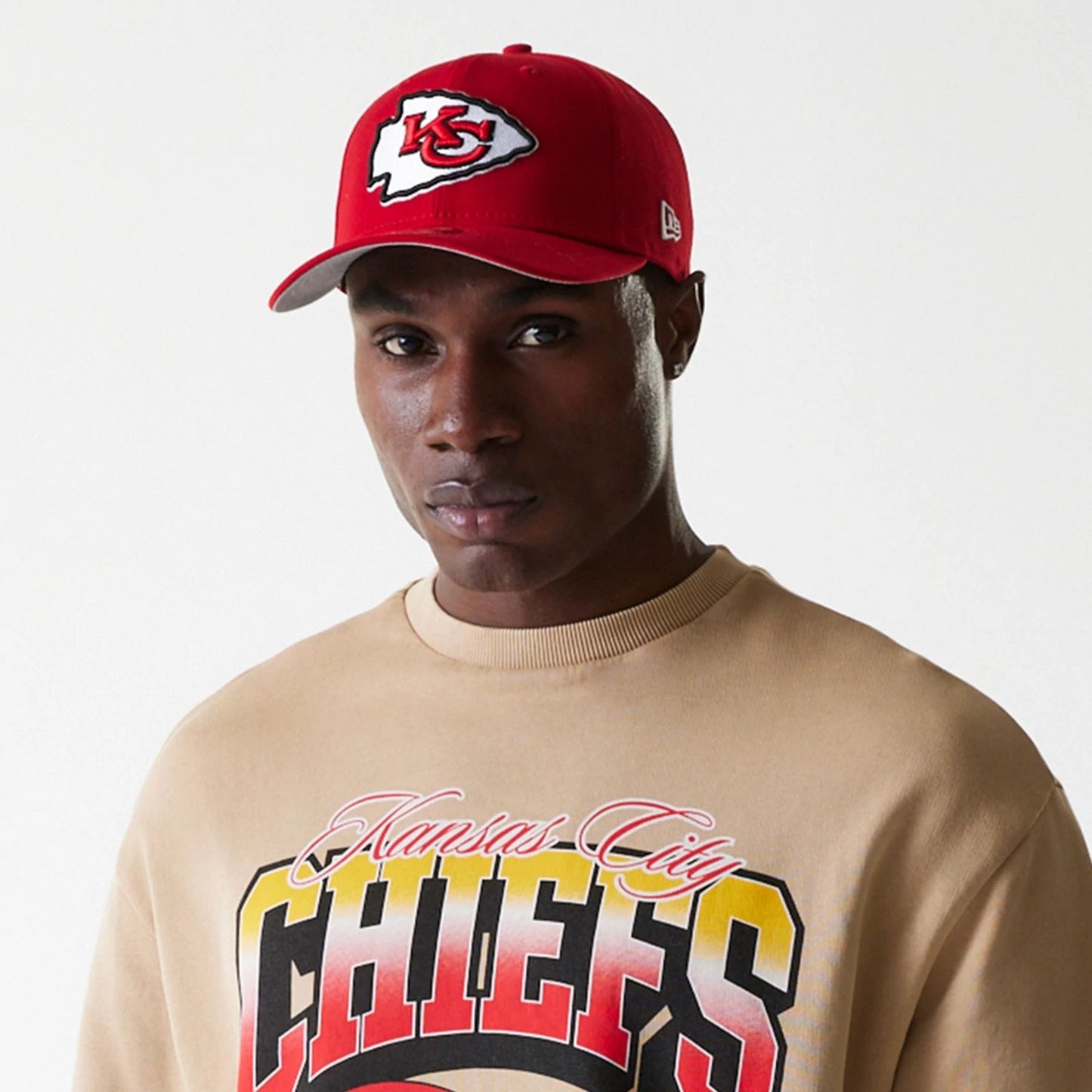 The Male model is wearing Kansas City Chiefs NFL Washed Super Bowl Beige Oversized Crew Neck Sweater 6