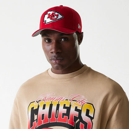 The Male model is wearing Kansas City Chiefs NFL Washed Super Bowl Beige Oversized Crew Neck Sweater 6