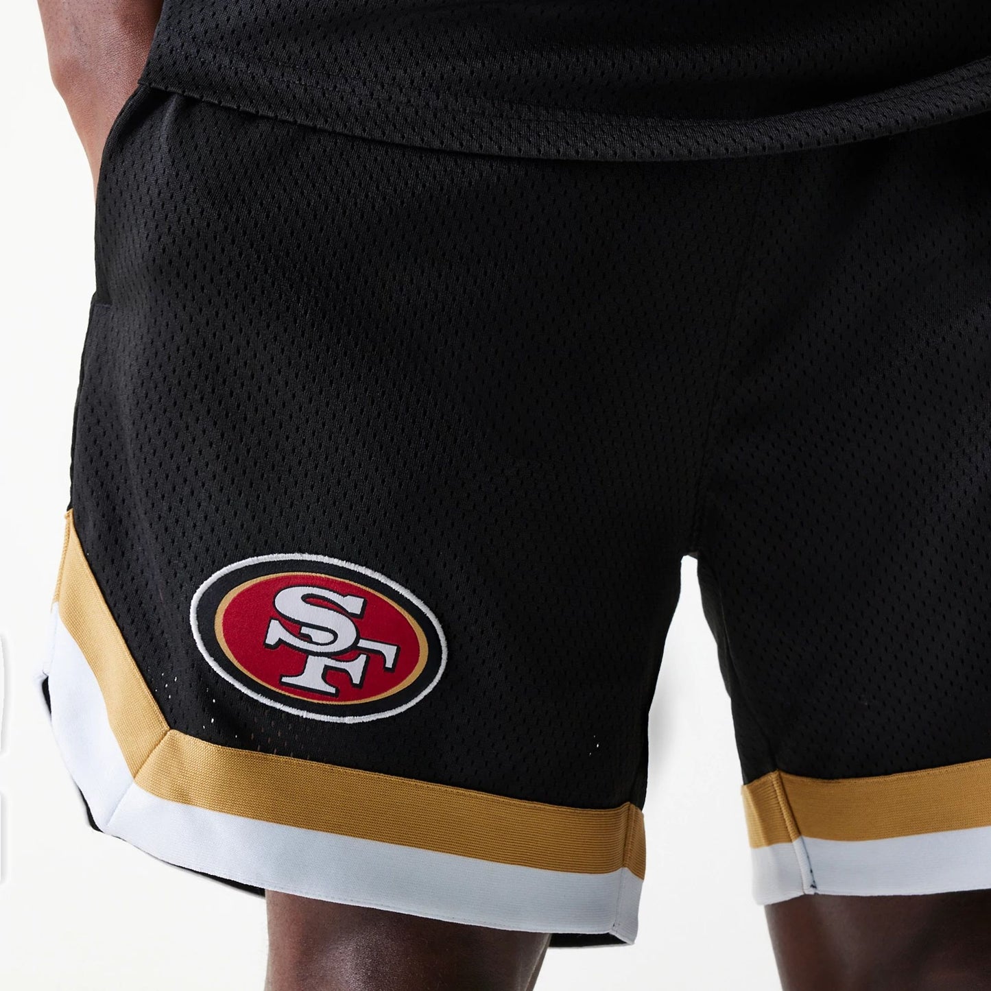 The Male model is wearing San Francisco 49ers NFL Mesh Black Shorts 3