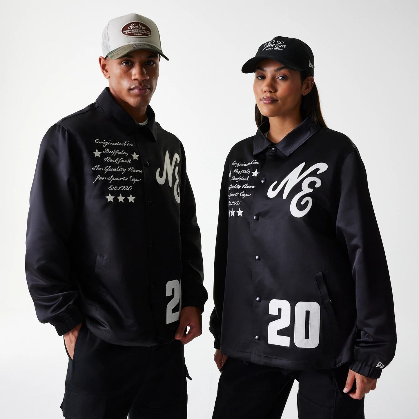 The Male model is wearing New Era Black Coaches Jacket 1