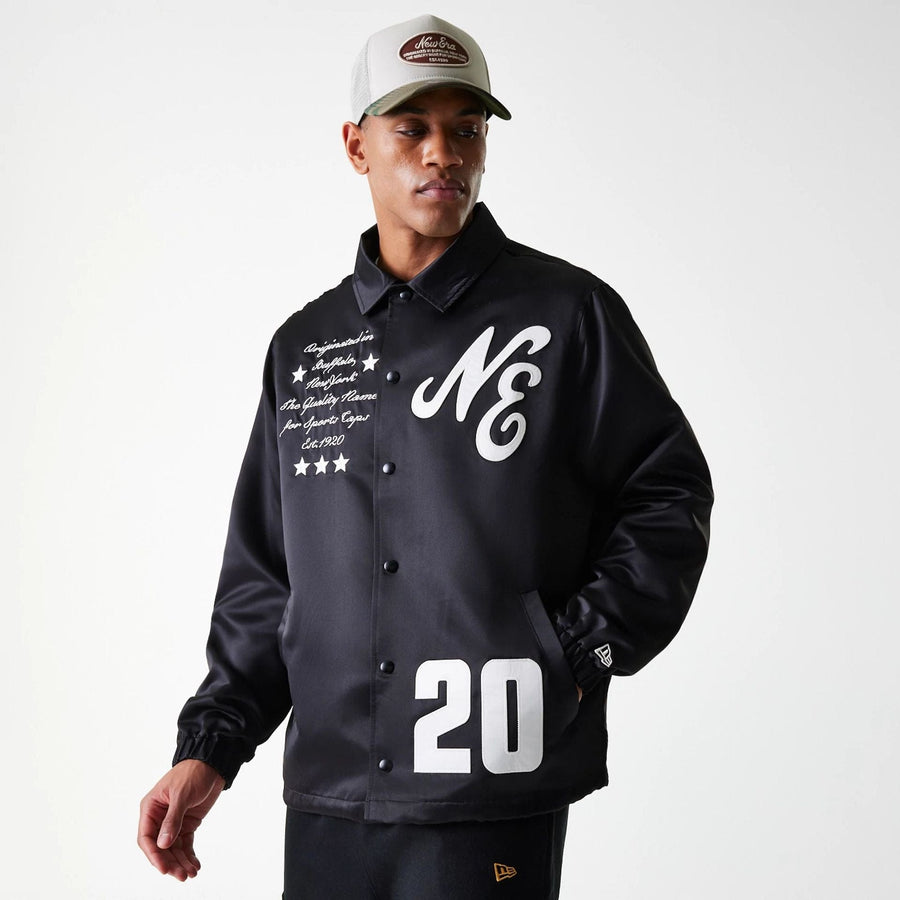 The Male model is wearing New Era Black Coaches Jacket 3