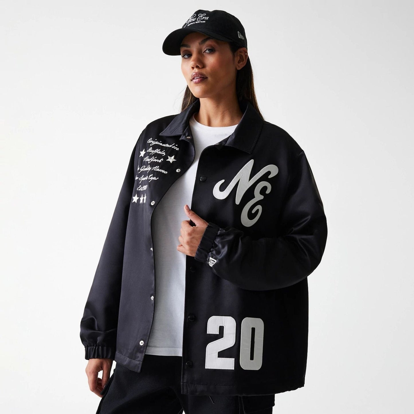 The Male model is wearing New Era Black Coaches Jacket 4