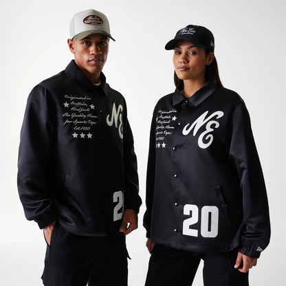 The Male model is wearing New Era Black Coaches Jacket 1