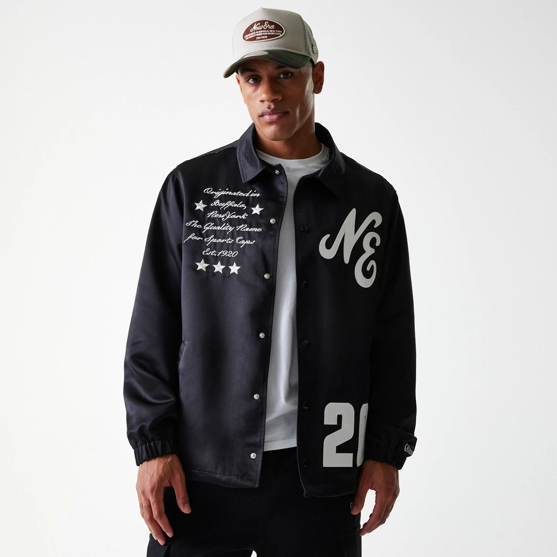 The Male model is wearing New Era Black Coaches Jacket 5