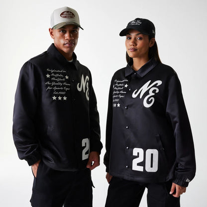 The Male model is wearing New Era Black Coaches Jacket 1