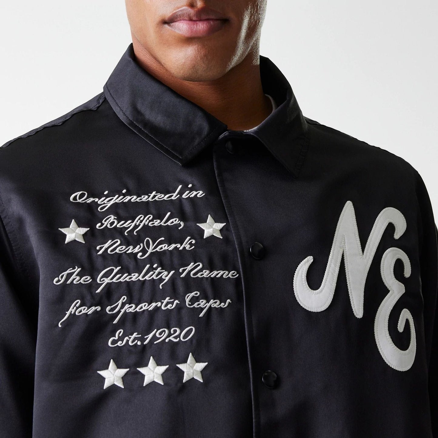 The Male model is wearing New Era Black Coaches Jacket 6