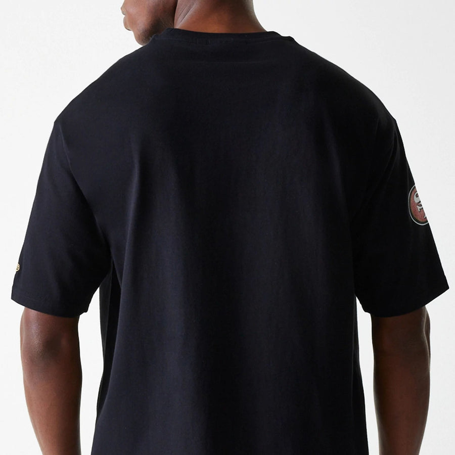 The Male model is wearing San Francisco 49ers NFL Wordmark Black Oversized T-Shirt 6