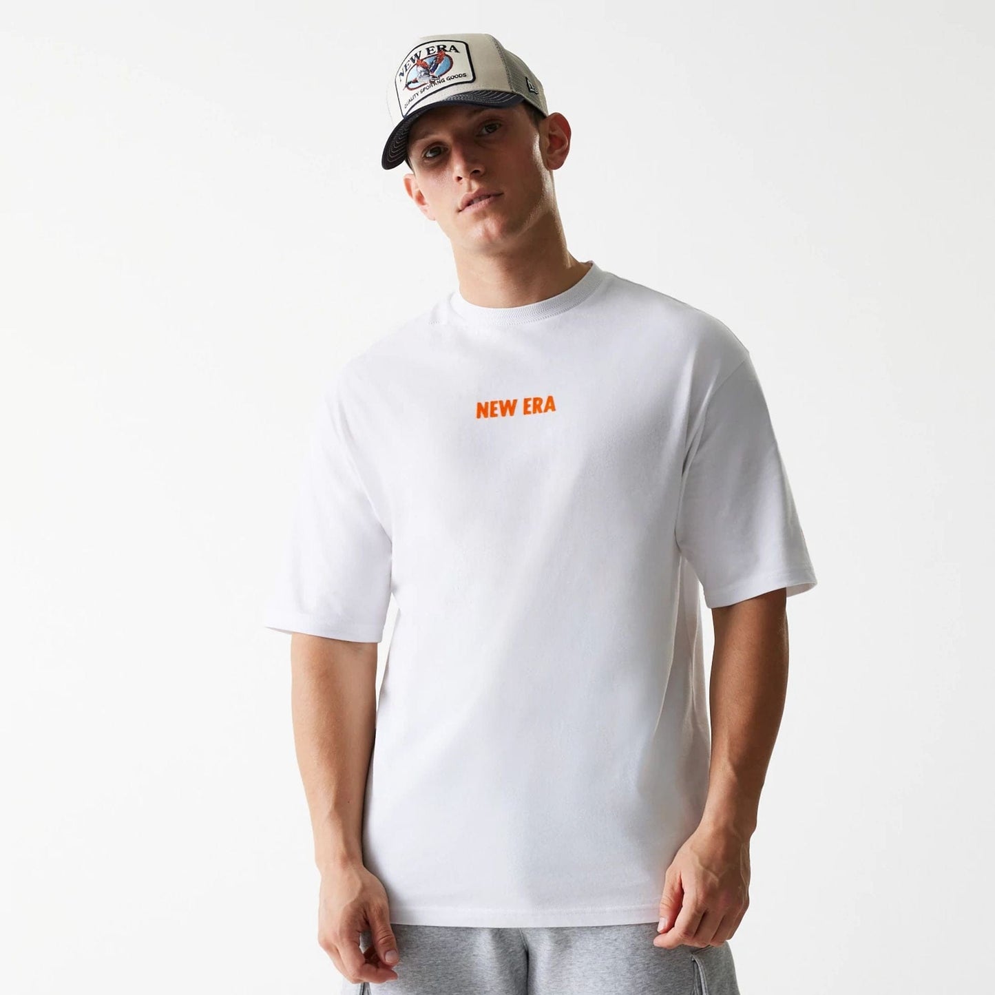 The Male model is wearing New Era Graphic White Oversized T-Shirt 1