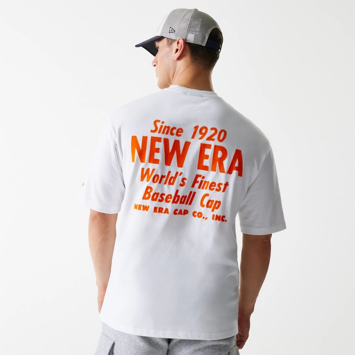 The Male model is wearing New Era Graphic White Oversized T-Shirt 2